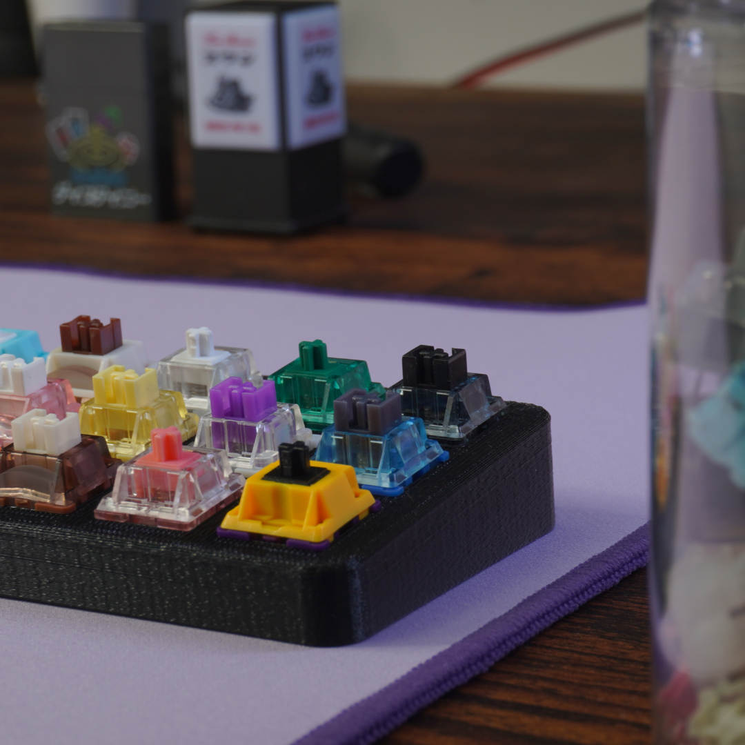 Artistic side view photo showing the details of the What The Thock 5x3 Switch tester with switches installed