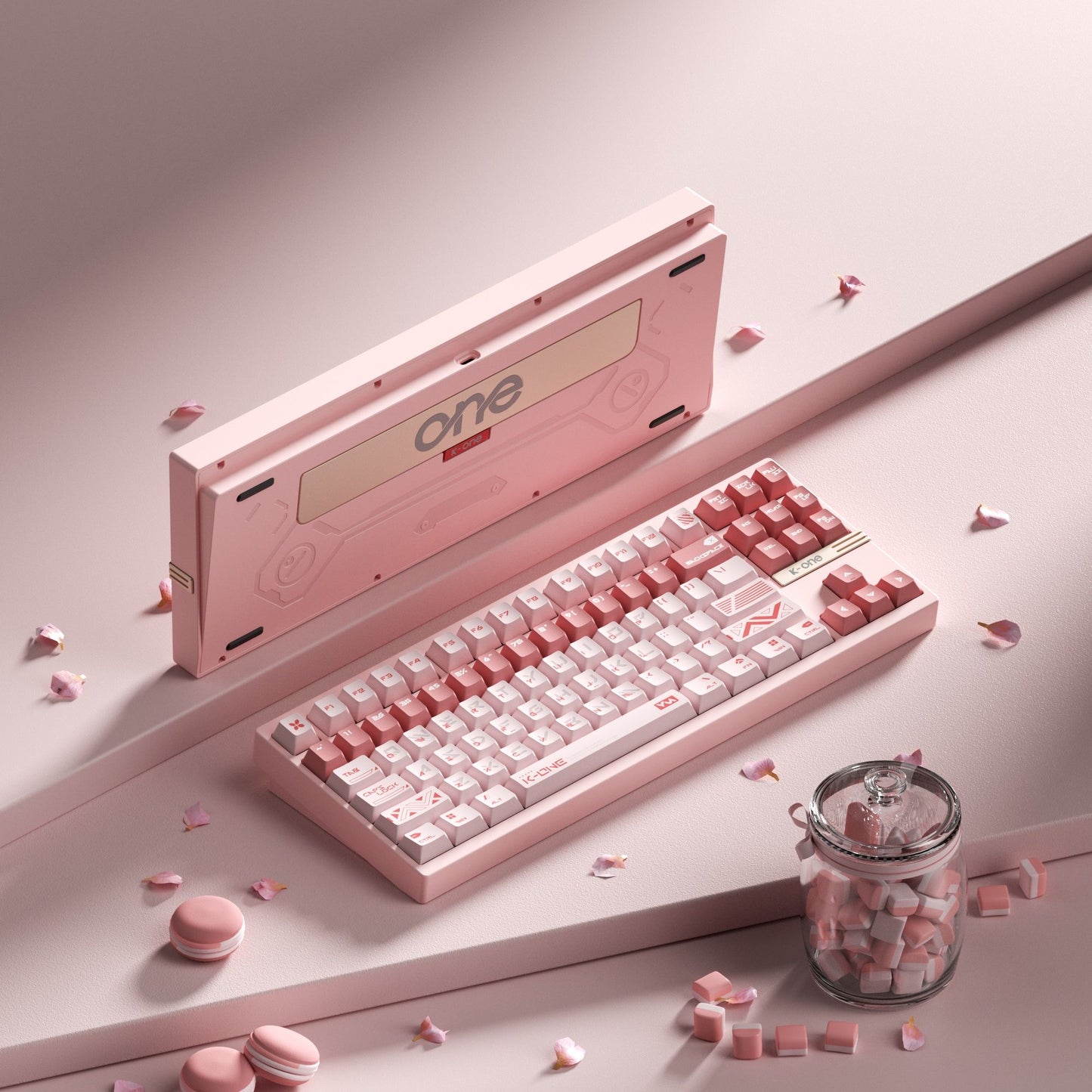 Pink keyboard with 'one' branding on a light surface with decorative elements.