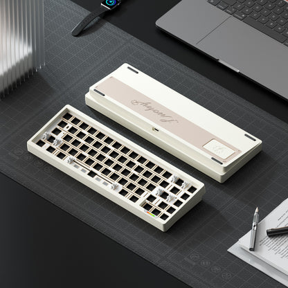 Mechanical keyboard on a desk with a laptop and stationery items