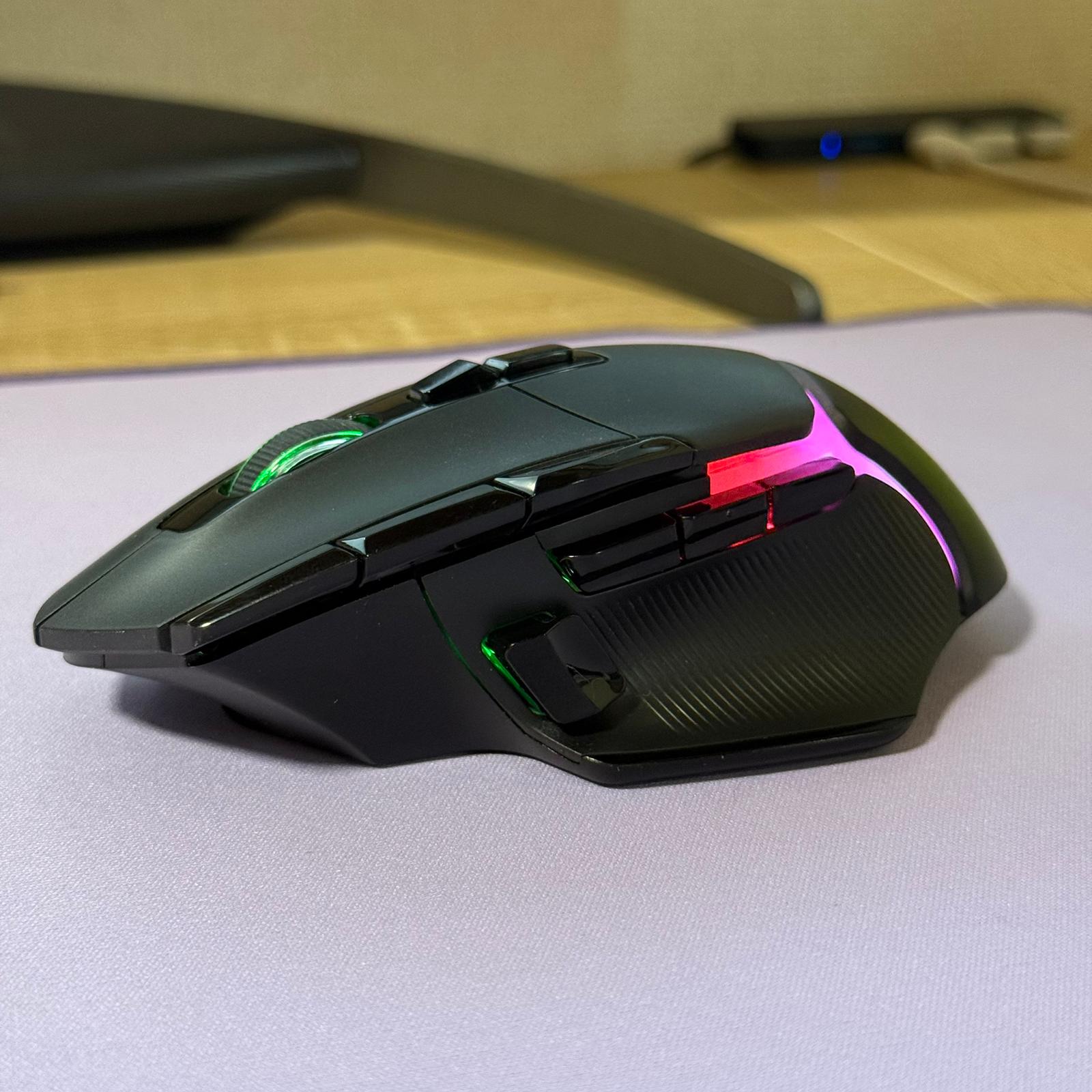 Gaming mouse with RGB lighting on a desk