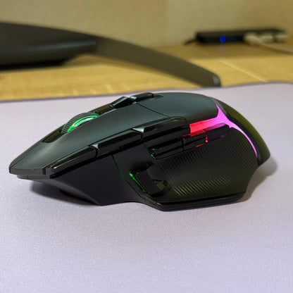 Gaming mouse with RGB lighting on a desk