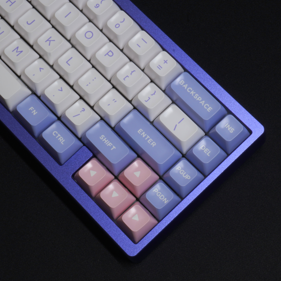 A Detail Photo of the What The Thock Lucky65 65% mechanical keyboard in the Lavender variant, showing a close up of the front righthand side