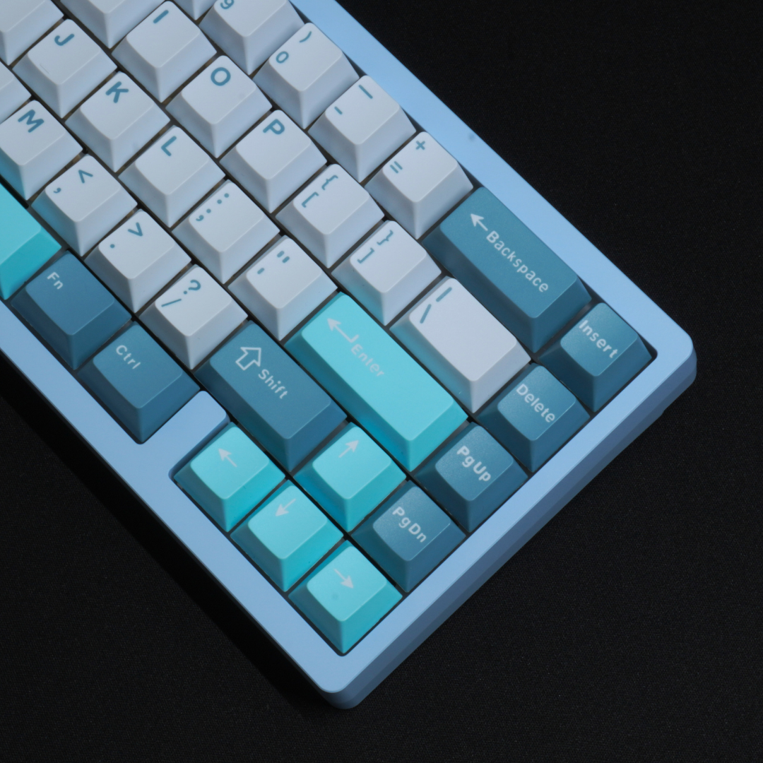 A Detail Photo of the What The Thock Lucky65 65% mechanical keyboard in the Ocean Blue variant, showing a close up of the front righthand side