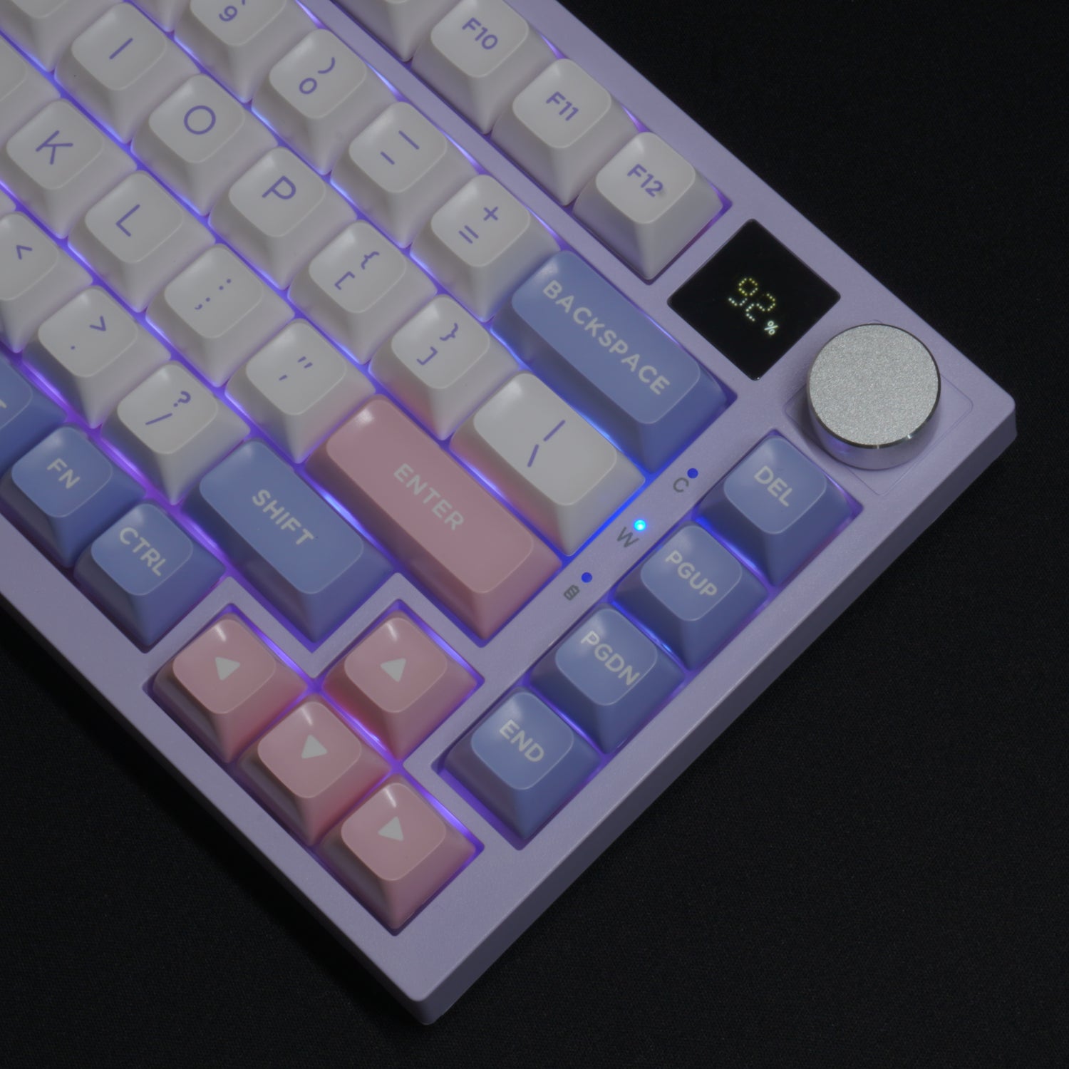 Purple version of the What The Thock Bubbly75 75% Mechanical Keyboard, Detail photo of the top right corner of the keyboard, detailing the media knob, screen, and RGB