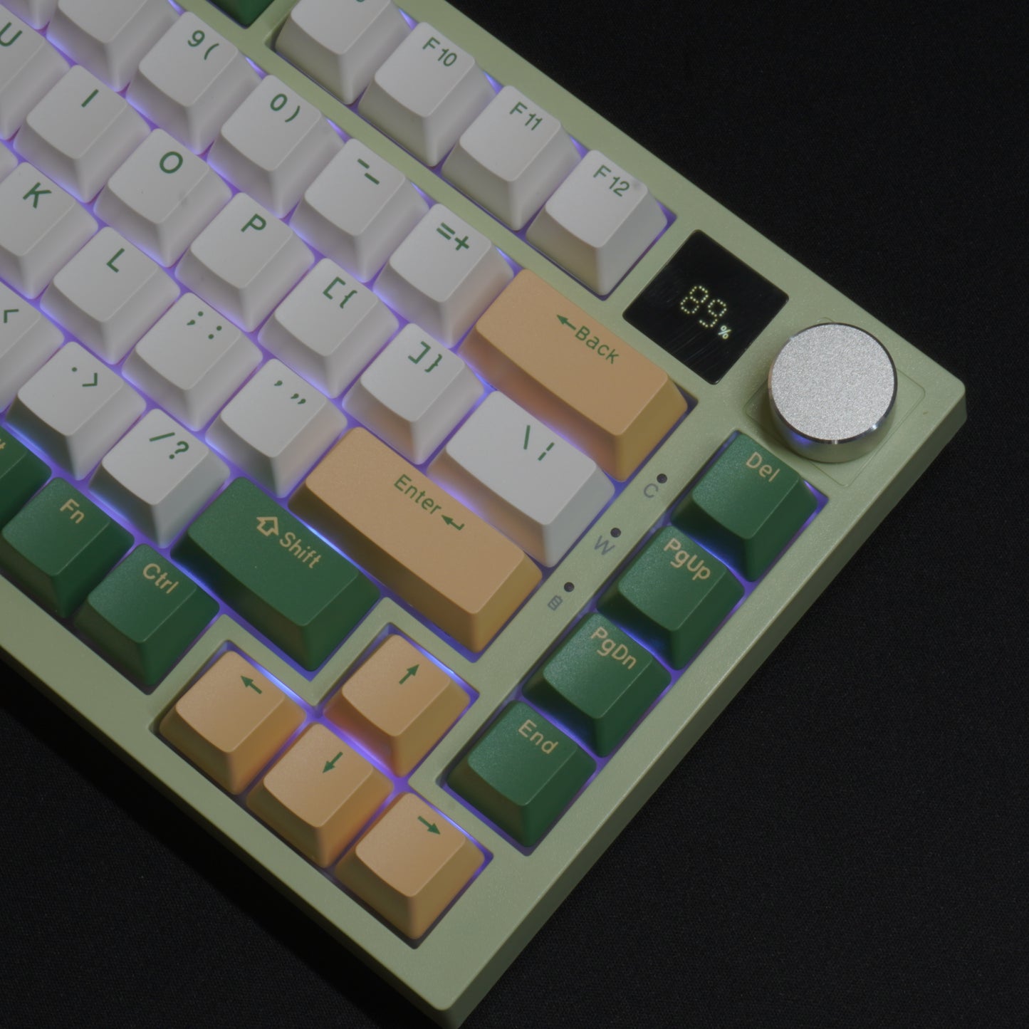 Green version of the What The Thock Bubbly75 75% Mechanical Keyboard, Detail photo of the top right corner of the keyboard, detailing the media knob, screen, and RGB