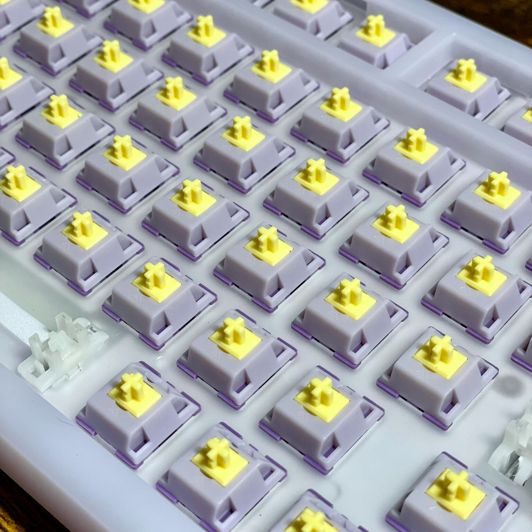 A photo of KTT Hyacinth linear mechanical switches mounted into a Mechanical keyboard