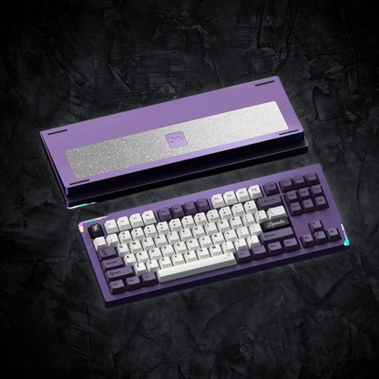 Purple mechanical keyboard with a metallic accent on a dark textured background
