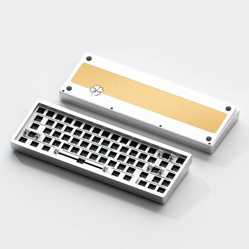 A Photo of the What The Thock Lucky65 65% mechanical keyboard showing the front and back of the silver variant in barebones form