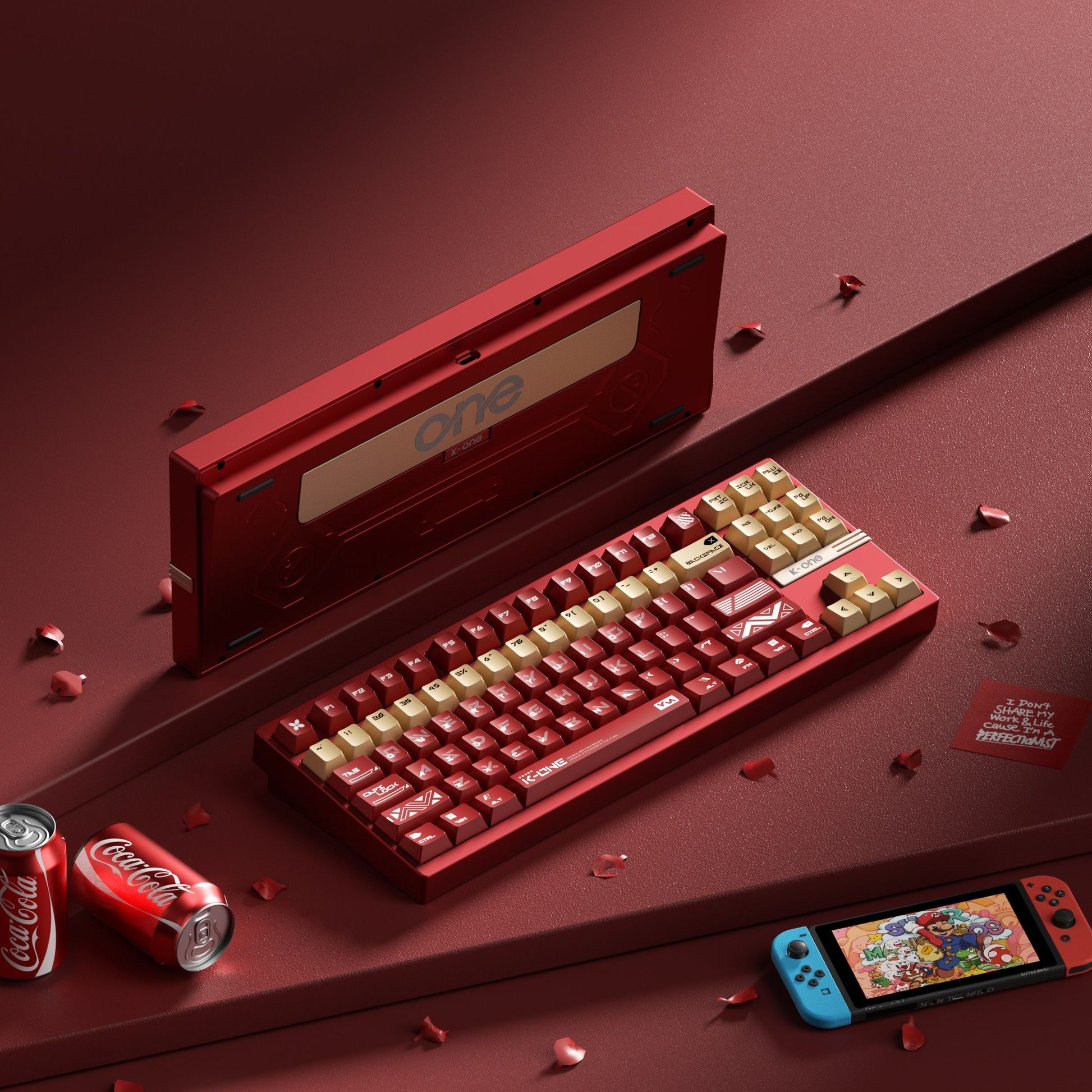 Red keyboard with Coca-Cola cans and a phone on a red background