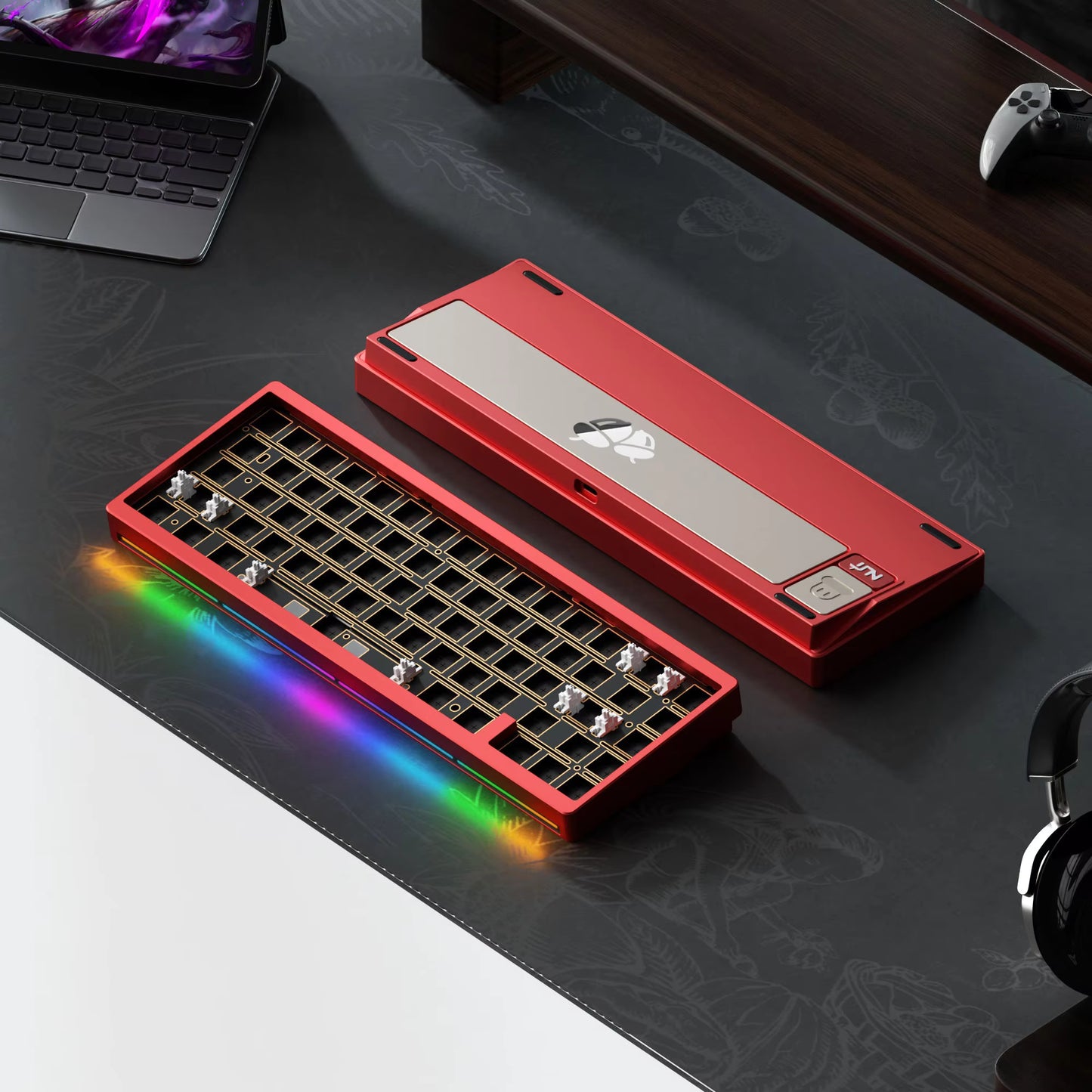 Red and silver keyboard on a dark desk with colorful lighting effects